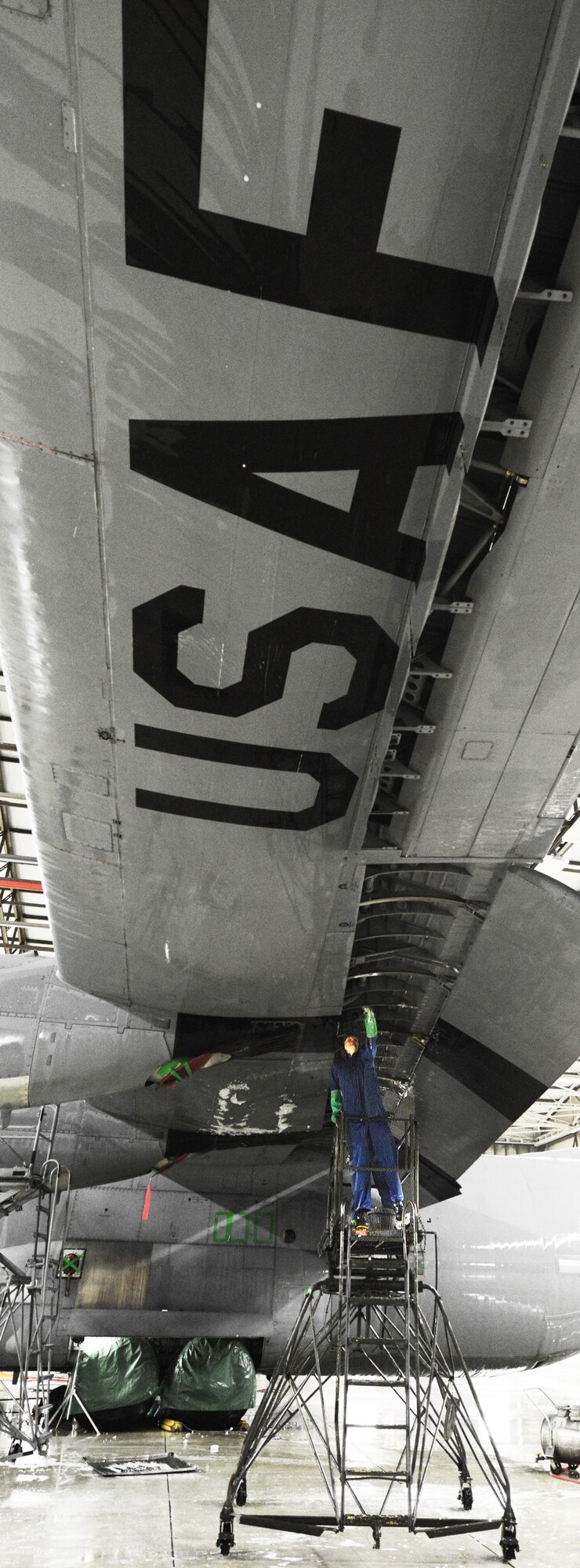 Airman 1st Class Enoch Wentland, 86th Maintenance Squadron crew chief, scrubs the wing of a C-130J Super Hercules, Feb. 10, 2014, Ramstein Air Base, Germany. Airman of the 86th MXS and the 86 Aircraft Maintenance Squadron work daily to keep the aircraft mobile and in working condition. (U.S. Air Force photo/Airman Dymekre Allen)