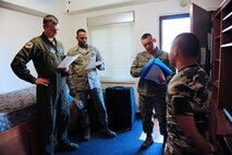 Staff Sgt. Nathan Richards, 39th Civil Engineer Squadron unaccompanied housing manager conducts a final-out dorm inspection Feb. 13, 2014, Incirlik Air Base, Turkey.  Col. Craig Wills, 39th Air Base Wing commander and Chief Master Sgt. Anthony Johnson, 39th ABW command chief experienced the daily duties of Airmen from the unaccompanied housing office on Incirlik AB. (U.S. Air Force photo by Airman 1st Class Nicole Sikorski/Released)