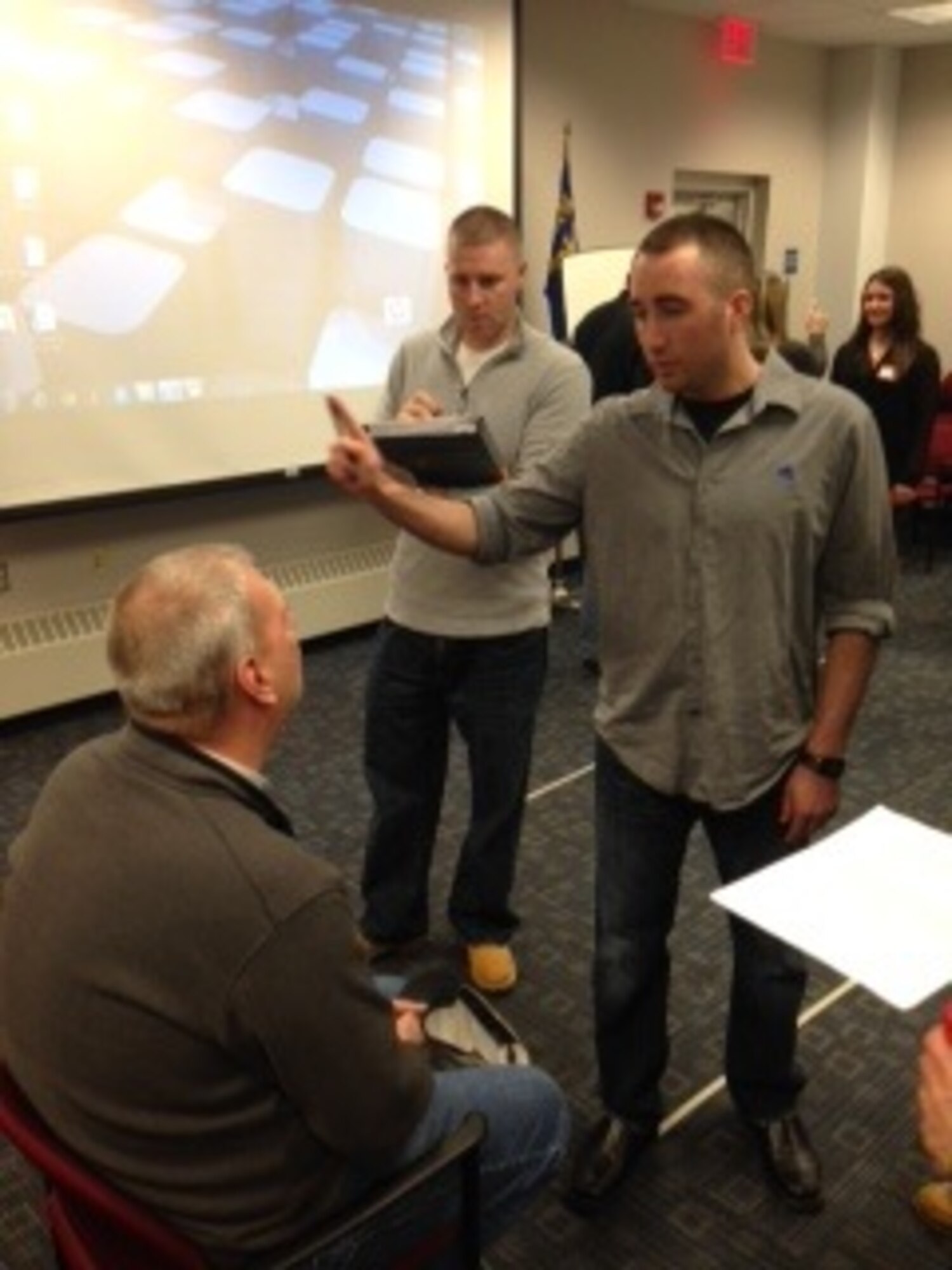 Staff Sgt. Lee Crusa, 911th Security Forces controller, performs a Horizontal Gaze Nystagmus (HGN) test on Tom Sivewright (seated), Moon Township Police Department dispatcher, during the three-day Standardized Field Sobriety Testing (SFST) training course here at the Pittsburgh International Airport Air Reserve Station, Jan. 29 – 31, 2014. The training was provided by the Pennsylvania DUI Association in conjunction with the West Hills DUI Task Force, and was attended by Staff Sgts. Lee Crusa and Raymon Bouyer and Tech. Sgts. Chris Vargas and Tana Sanchez from the 911th Security Forces Squadron.