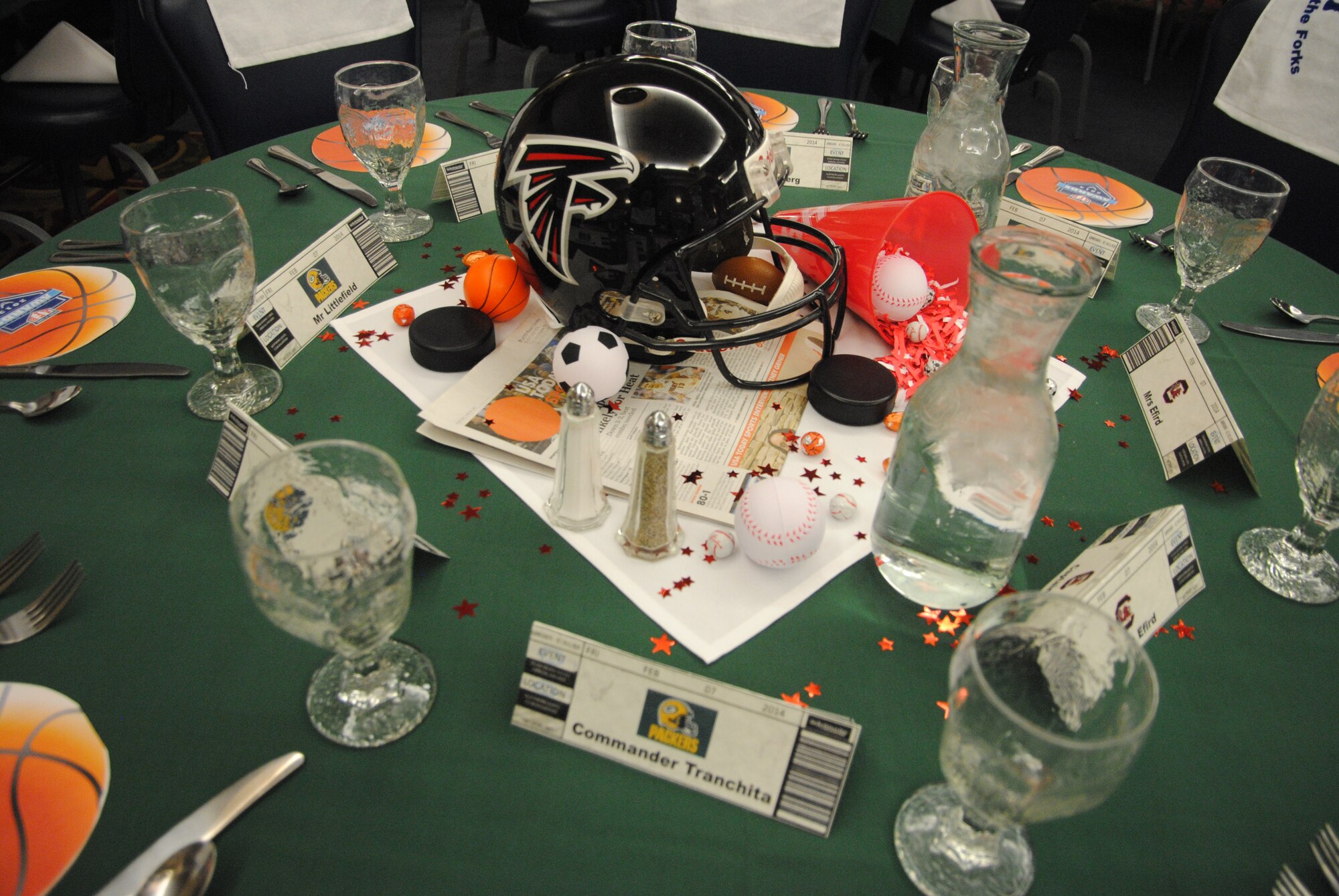 Newspaper sports sections and adult-size football helmets from both the NCAA and the NFL were used as centerpieces and décor for the sports theme of the 2013 Grand Forks Air Force Base Annual Awards held Feb. 7, 2014, at the Northern Lights Club on Grand Forks AFB, N.D. (U.S. Air Force photo/Staff Sgt. Luis Loza Gutierrez) 