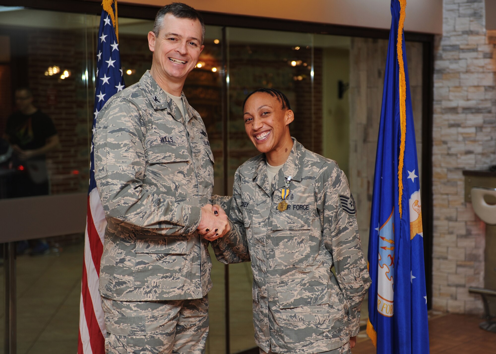 Tech. Sgt. Sheree Luckey, 39th Air Base Wing protocol NCO in charge, is awarded the "Pick of the 'Lik" for the week of Feb. 10, 2014, at Incirlik Air Base, Turkey. The 39th Air Base Wing leadership recognizes Airmen for demonstrating outstanding leadership and job performance abilities. (U.S. Air Force photo by Senior Airman Chase Hedrick/Released)