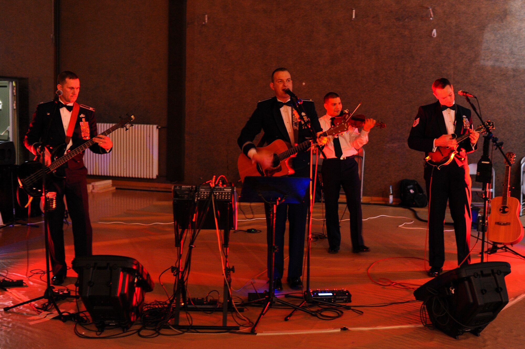 The band Weekend Duty plays after the 2013 Annual Awards Banquet Feb. 8, 2014, at Spangdahlem Air Base, Germany. The band supports the local community and Airmen by playing at events like the Annual Awards banquet. (U.S. Air Force photo by Senior Airman Rusty Frank/Released)