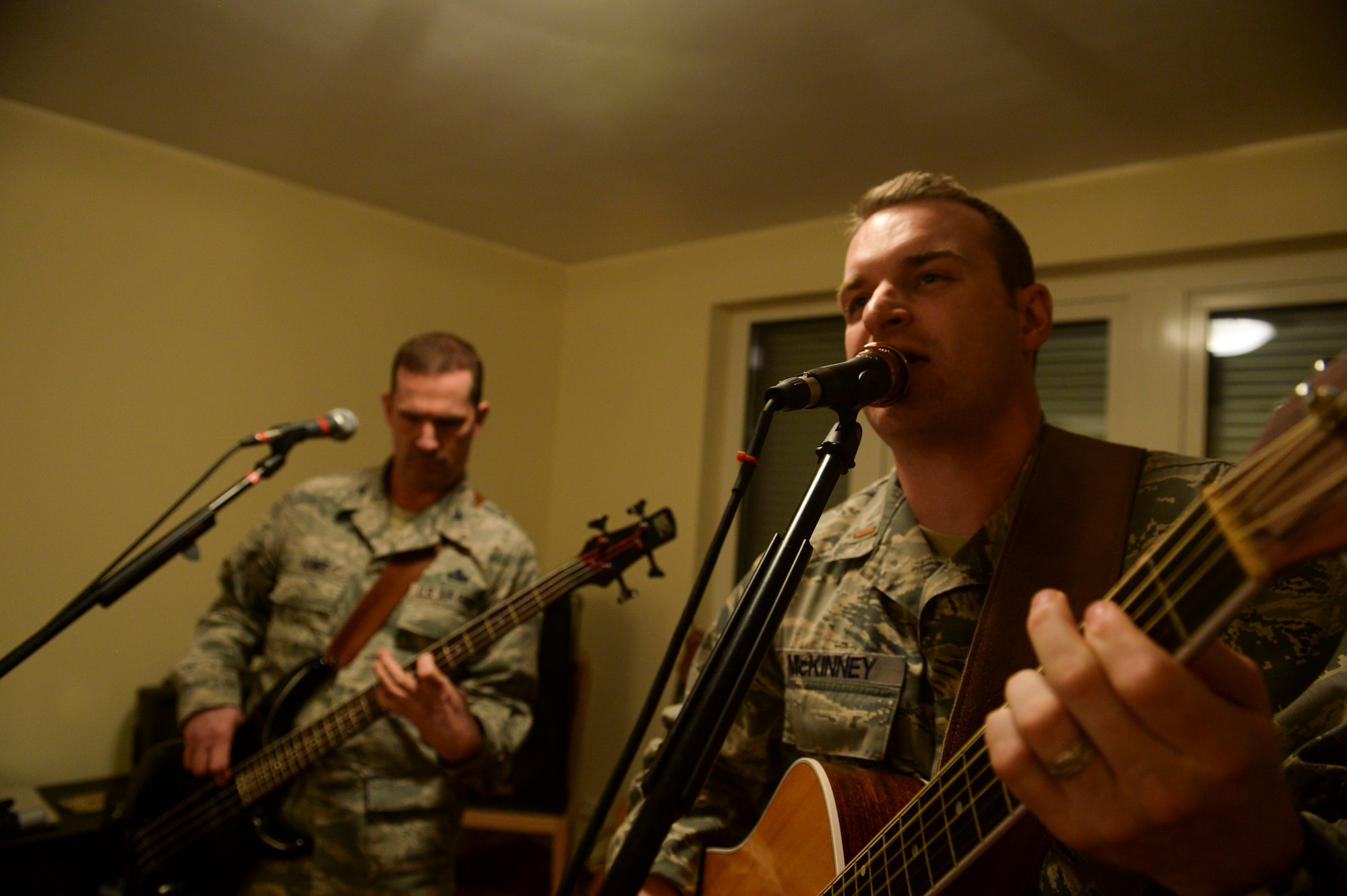 U.S. Air Force 2nd Lt. John McKinney, 52nd Aircraft Maintenance Squadron assistant officer in charge of the 480th Aircraft Maintenance Unit from New Ellenton, S.C., sings a song during a rehearsal session with Weekend Duty Jan. 29, 2014, at Spangdahlem Air Base, Germany. McKinney and U.S. Air Force Col . Matt Humes, 52nd Aircraft Maintenance Group commander, started the band during a New Years Eve party. (U.S. Air Force photo by Senior Airman Rusty Frank/Released)