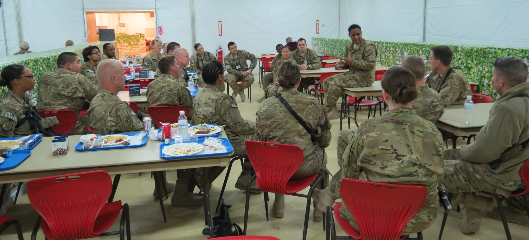 Air Force Central Command’s Command Chief Master Sgt. Shelina Frey fields a question asked by an Airman during a luncheon at Kandahar Airfield, Afghanistan, Feb. 12, 2014. Frey is touring bases in Afghanistan talking to Airmen and answering questions.(U.S. Air Force photo by Staff Sgt. Joseph Needham/Released)