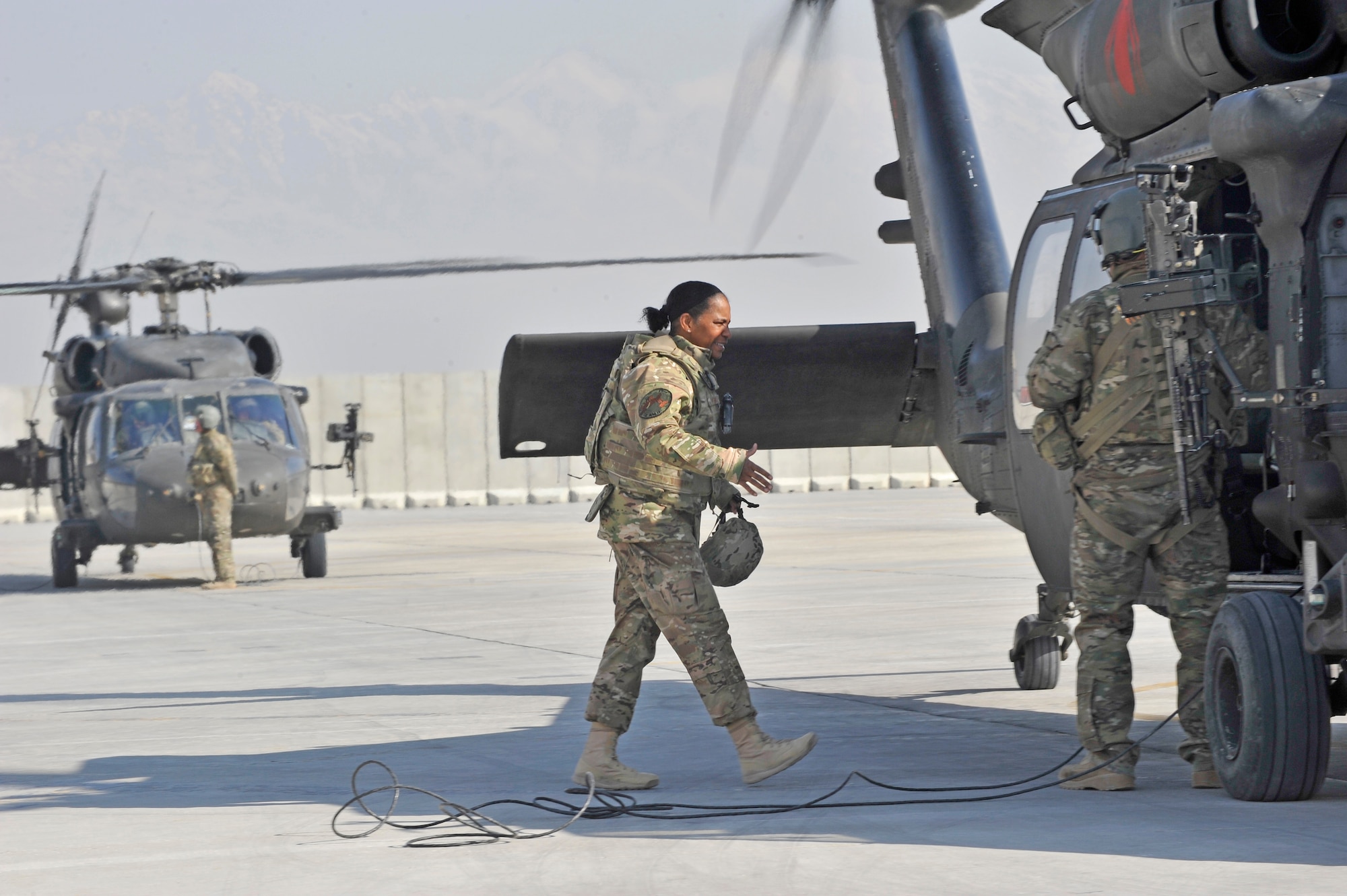 Air Force Central Command’s Command Chief Master Sgt. Shelina Frey prepares to board a UH-60 Blackhawk helicopter at Bagram Airfield, Afghanistan, Feb. 13, 2014. Frey is touring bases in Afghanistan talking to Airmen and answering questions.(U.S. Air Force photo by Senior Master Sgt. Gary J. Rihn/Released)
