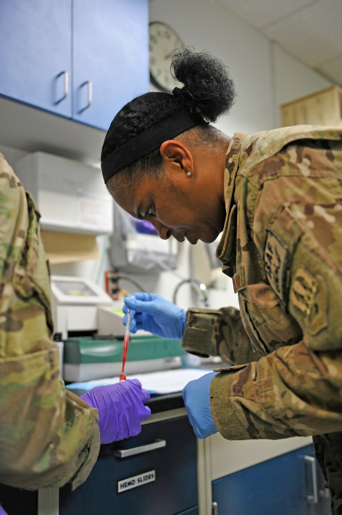 Air Force Central Command’s Command Chief Master Sgt. Shelina Frey conducts tests to obtain blood gas levels along with coagulation tests at the Craig Joint Theater Hospital at Bagram Airfield, Afghanistan, Feb. 12, 2014. Frey is touring bases in Afghanistan talking to Airmen and answering questions.(U.S. Air Force photo by Senior Master Sgt. Gary J. Rihn/Released)