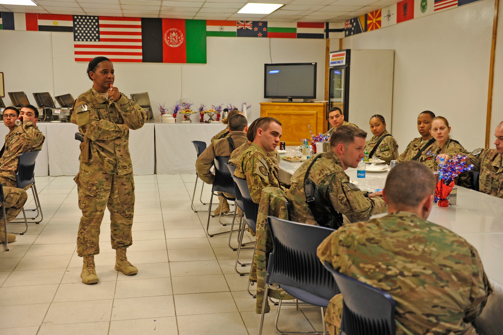 Air Force Central Command’s Command Chief Master Sgt. Shelina Frey listens to a question asked by an Airman during a luncheon at Bagram Airfield, Afghanistan, Feb. 12, 2014. Frey is touring bases in Afghanistan talking to Airmen and answering questions.(U.S. Air Force photo by Senior Master Sgt. Gary J. Rihn/Released)