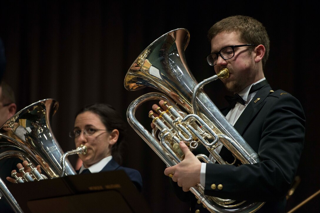Luxembourg Air Force Sgt. Marc Mollitor, a Luxembourg Musique Militaire euphonium player, performs during a joint concert with the U.S. Air Forces in Europe Band brass ensemble Feb. 11, 2014, at the Mehrzweckhalle in Kenn, Germany.  The Mission of the U.S. Air Force bands is to support the global Air Force mission in war and peace by preserving national heritage providing professional musical products and services for official military, recruiting and community relations events. (U.S. Air Force photo by Staff Sgt. Christopher Ruano/Released)