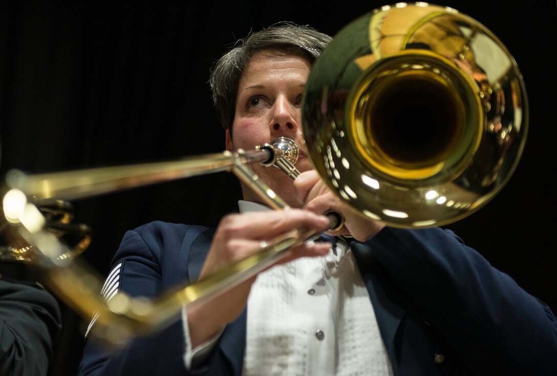 U.S. Air Force Tech. Sgt. Saundra Sininger, U.S. Air Forces in Europe Band brass ensemble trombone player from Williamstown, Ky., performs during a joint concert with the Luxembourg Air Force’s Musique Militaire Feb. 11, 2014, at the Mehrzweckhalle in Kenn, Germany. The USAFE Brass Ensemble showcases a diverse repertoire of traditional classical transcriptions, jazz standards, new arrangements as well as other songs reflecting the group's American roots. (U.S. Air Force photo by Staff Sgt. Christopher Ruano/Released)