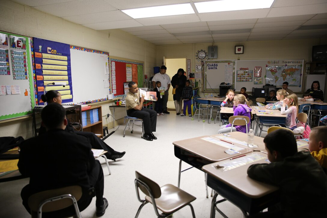 Petty Officer 3rd Class Christopher Parchmon reads aloud to a class of children during Graham A. Barden Elementary School’s family reading night Feb. 7. Parchmon is a hospital corpsman with Marine Corps Air Station Cherry Point’s Naval Health Clinic.
