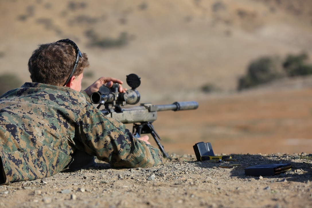 Sgt. Michael Currier, a scout with Company A, 1st Reconnaissance Battalion, 1st Marine Division, makes adjustments to the scope of his M-40A5 as he prepares to engage a fixed target. I Marine Expeditionary Force, Special Operations training Group, Special Missions Branch conducted a training event for scouts from 1st Reconnaissance Battalion aboard Camp Pendleton, Calif., Feb 12.