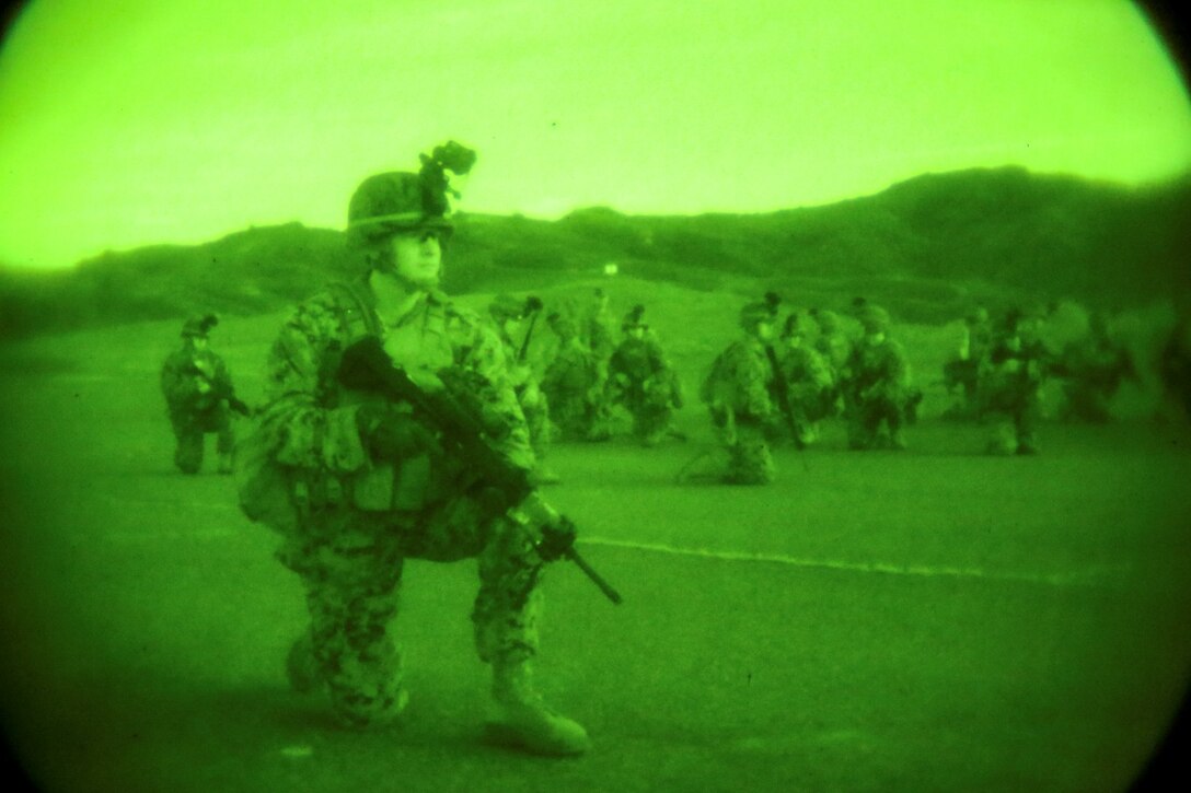 U.S. Marine Cpl. Miguel DelCampo, 1st Battalion, 1st Marine Regiment, provides security while conducting helicopter assault training during Exercise Iron Fist 2014 aboard Camp Pendleton, Calif., Feb. 12, 2014. Iron Fist is an amphibious exercise that brings together Marines and sailors from the 15th Marine Expeditionary Unit, other I Marine Expeditionary Force units, and soldiers from the Japan Ground Self-Defense Force, to promote military interoperability and hone individual and small-unit skills through challenging, complex and realistic training. (U.S. Marine Corps photo by Cpl. Emmanuel Ramos/Released)