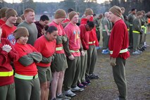 U.S. Navy Capt. Michael A. Sokolowski, a Fulton, Mich., native and commanding officer of 2nd Medical Battalion, Combat Logistics Regiment 25, 2nd Marine Logistics Group, talks to Marines and sailors in Alpha Company at Soiffert Field during the cardiac run aboard Camp Lejeune, N.C., Feb. 14, 2014. Marines and sailors wore red to promote a healthier lifestyle and to show support to their family members for Valentine’s Day.