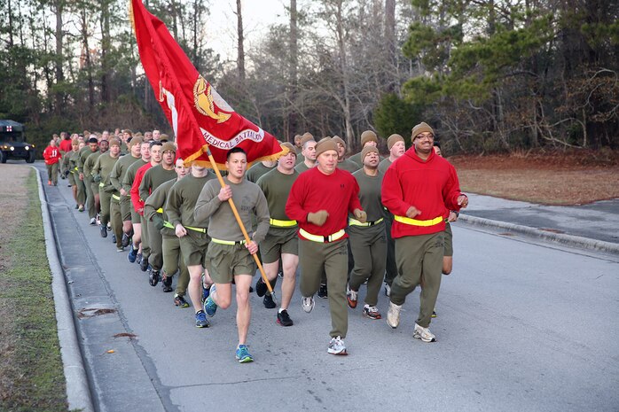 U.S. Navy Capt. Michael A. Sokolowski (center), a Fulton, Mich., native and commanding officer of 2nd Medical Battalion, Combat Logistics Regiment 25, 2nd Marine Logistics Group, leads the battalion in the cardiac run aboard Camp Lejeune, N.C., Feb. 14, 2014. Marines and sailors ran approximately three miles in support of a healthier lifestyle and Valentine’s Day. 