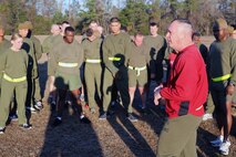 U.S. Navy Capt. Michael A. Sokolowski (right), a Fulton, Mich., native and commanding officer of 2nd Medical Battalion, Combat Logistics Regiment 25, 2nd Marine Logistics Group, speaks to Marines and sailors in the battalion about Valentine’s Day after the cardiac run at Soiffert Field aboard Camp Lejeune, N.C., Feb. 14, 2014. Service members had the option of wearing red to show their support of Valentine’s Day and to recognize a healthier lifestyle. 
