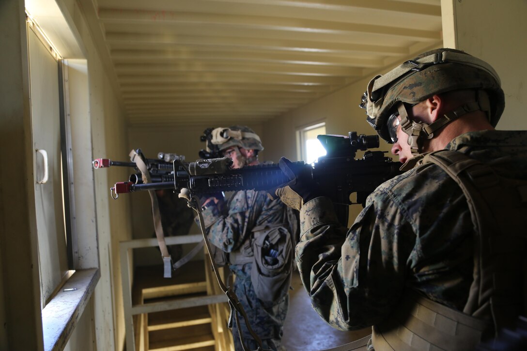 Marines with the 11th Marine Expeditionary Unit's ground combat element post security at a window during mechanized raid training here Feb. 12. Marines posted security at various points to provide suppressive fire when needed. This training event is one of the many evolutions the 11th MEU will conduct in preparation for their scheduled deployment this summer.   

