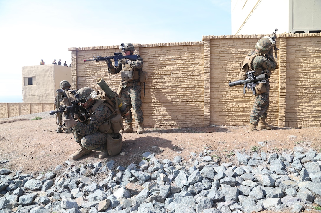 Marines with the 11th Marine Expeditionary Units ground combat element post security for other Marines infiltrating their objective during a mechanized raid training event here Feb. 12. Marines posted security at various points to provide suppressive fire when needed. This training event is one of many evolutions the 11th MEU will conduct in preparation for their scheduled deployment this summer.   
