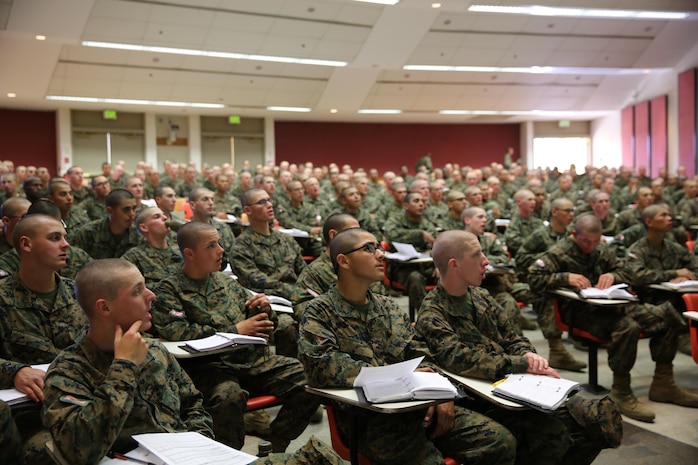 Recruits of Company B, 1st Recruit Training Battalion, learn about the Marine Corps uniforms during a Marine Corps uniform class, Feb. 5. The dress blue uniform is used for things such as recruiting or special events like the Marine Corps Ball.