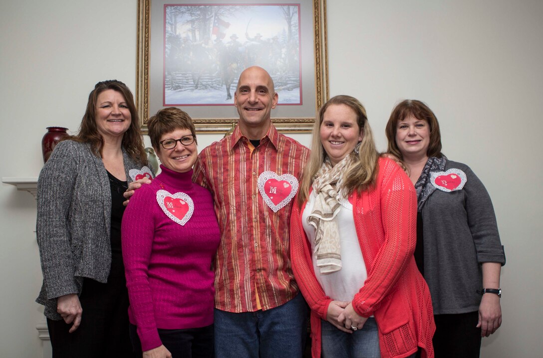 Col. Matthew G. St. Clair, center, 26th Marine Expeditionary Unit (MEU) commanding officer, held a get together to recognize efforts of family readiness volunteers, the link between deployed Marines, spouses and children left behind during the 26th MEU's latest deployment, Feb. 7, 2014. (U.S. Marine Corps photo by Cpl. Michael S. Lockett/Released)