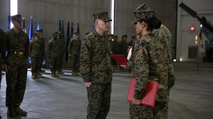 Sgt. Maj. Lynnette C. Marr-Gaye relieves Sgt. Maj. Marion L. Hammerschmidt Jr., as the Marine Light Attack Helicopter Squadron 269 sergeant major in a ceremony at the squadron's hangar, Feb. 13.