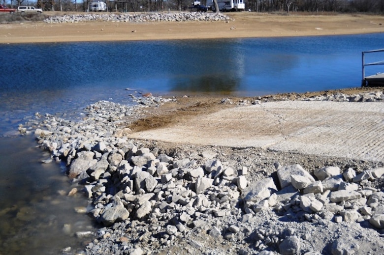 An extreme multiyear drought has caused the water level of Lake Texoma to drop several feet below normal. Here the water level has dropped past the end of this boat ramp.
