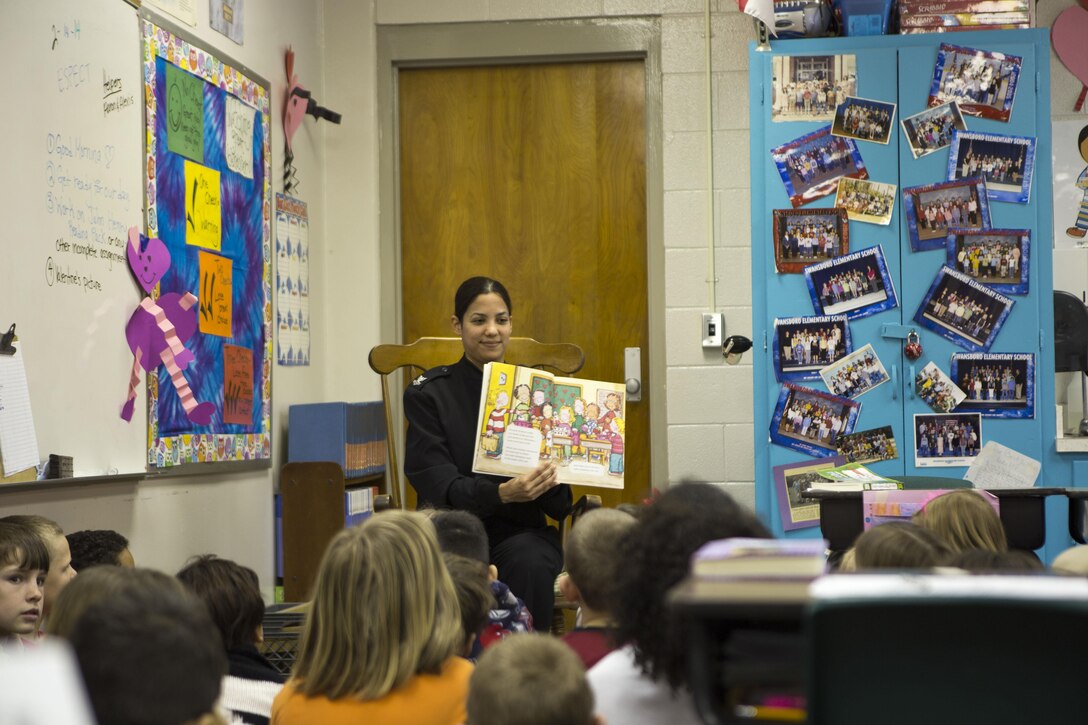 U.S. Navy Religious Programs Specialist 2nd Class Dafnne Poirier, 26th Marine Expeditionary Unit (MEU), interacts with students at Swansboro Elementary School as parts of the 26th MEU's partnership with the school in Swansboro, N.C., Feb. 14, 2014. (U.S. Marine Corps photo by Staff Sgt. Edward Guevara/Released)