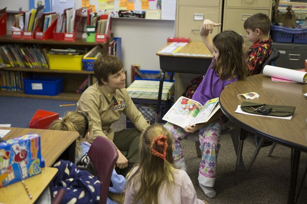 U.S. Marine Corps Maj. C. Faith Zimmerman, 26th Marine Expeditionary Unit (MEU) assistant logistics officer, interacts with students at Swansboro Elementary School as parts of the 26th MEU's partnership with the school in Swansboro, N.C., Feb. 14, 2014. (U.S. Marine Corps photo by Staff Sgt. Edward Guevara/Released)