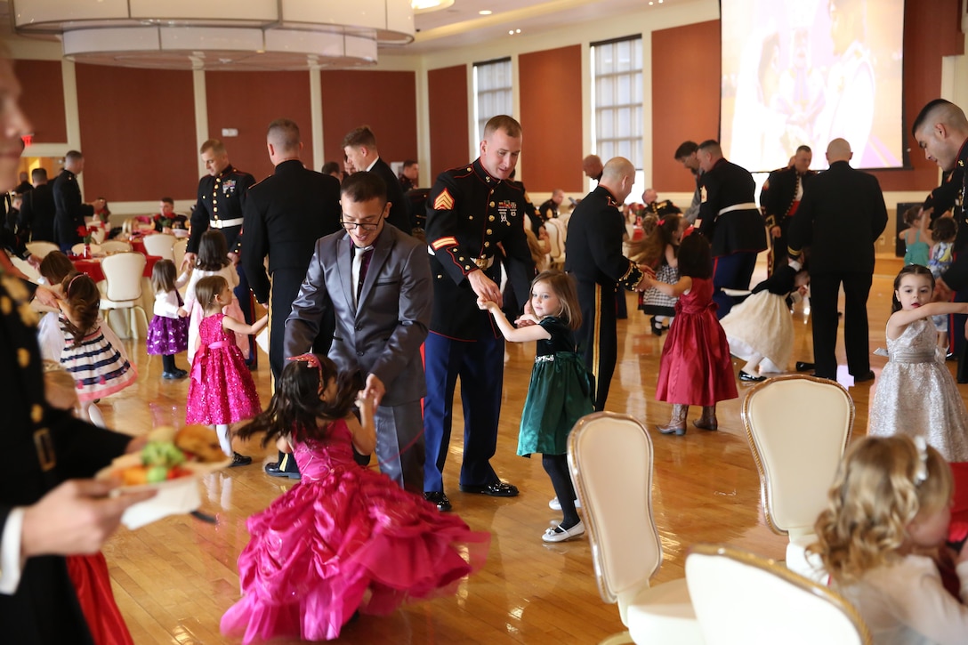 Fathers and daughters enjoy dressing up and dancing at the Tiny Miss Daddy-Daughter Dance held Feb. 8, 2014 at the Marston Pavilion aboard Marine Corps Base Camp Lejeune.