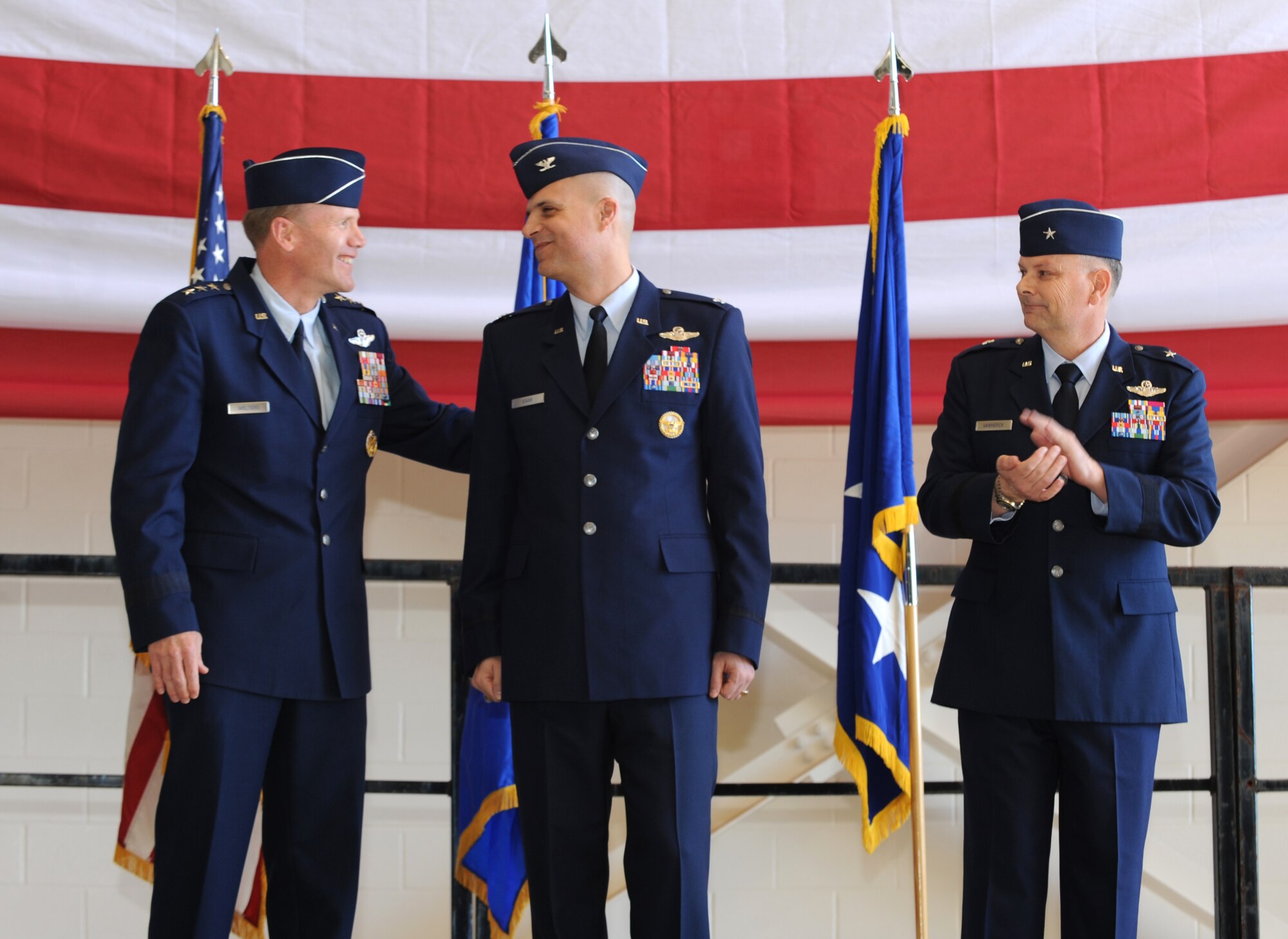 U.S. Air Force Lt. Gen. Tod Wolters, left, 12th Air Force commander, and Brig. Gen. Glen VanHerck, right, congratulate Col. Michael Bob Starr on his new command of the 7th Bomb Wing Feb. 14, 2014, at Dyess Air Force Base, Texas.  As commander, Starr is responsible for the health and welfare of more than 12,000 active duty members, civilian employees and family members. In addition, he provides combat-ready B-1 aircraft, crews and associated combat support for global engagement taskings. (U.S. Air Force Photo by Airman 1st Class Kedesha Pennant/Released)