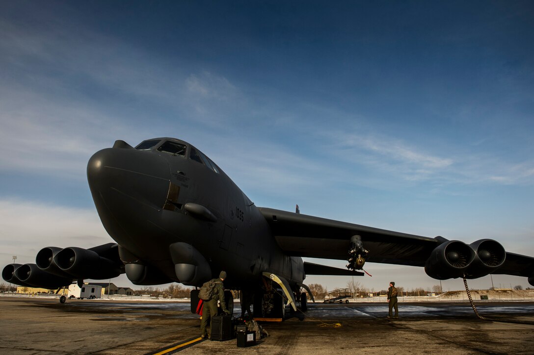 Capts. Matthew Smith and Austin Fouts, 23rd Bomb Squadron pilots, conduct a pre-flight inspection on a B-52H Stratofortress at Minot Air Force Base, N.D., Feb. 11, 2014. The B-52 is capable of flying at high subsonic speeds at altitudes up to 50,000 feet. It can carry a variety of weapons including nuclear and precision-guided conventional ordnance with worldwide precision navigation capability. (U.S. Air Force photo by Staff Sgt. Jonathan Snyder/RELEASED)