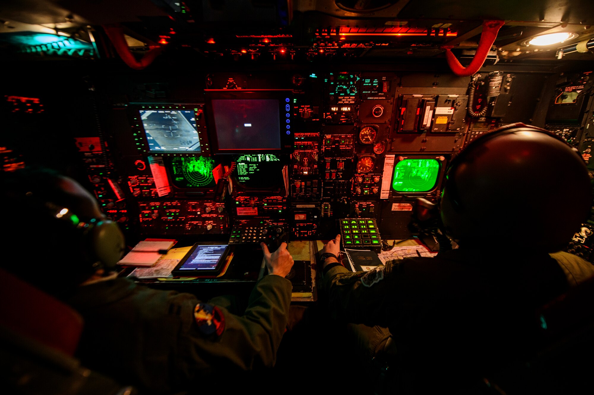 Capt. Zachary Proano, 23rd Bomb Squadron radar navigator, and Capt. Andrew Parlsen, 23rd BS navigator, conduct a training mission on a B-52H Stratofortress over Nev., Feb. 11, 2014. The 23rd BS conducted a live ordnance training mission dropping a Cluster Bomb Unit 103 and CBU-87 at the Nevada Test and Training Range. (U.S. Air Force photo by Staff Sgt. Jonathan Snyder/RELEASED)

