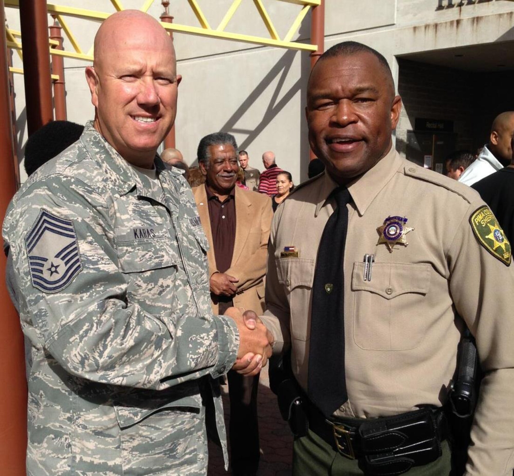 Chief Master Sgt. Brian Karas congratulates Master Sgt. Wendell Jones for graduating from the Sheriff’s Department Academy Jan. 24.  Jones has dedicated himself to serve the Tucson community as both a sheriff and Air Guardsman. (Courtesy Photo)