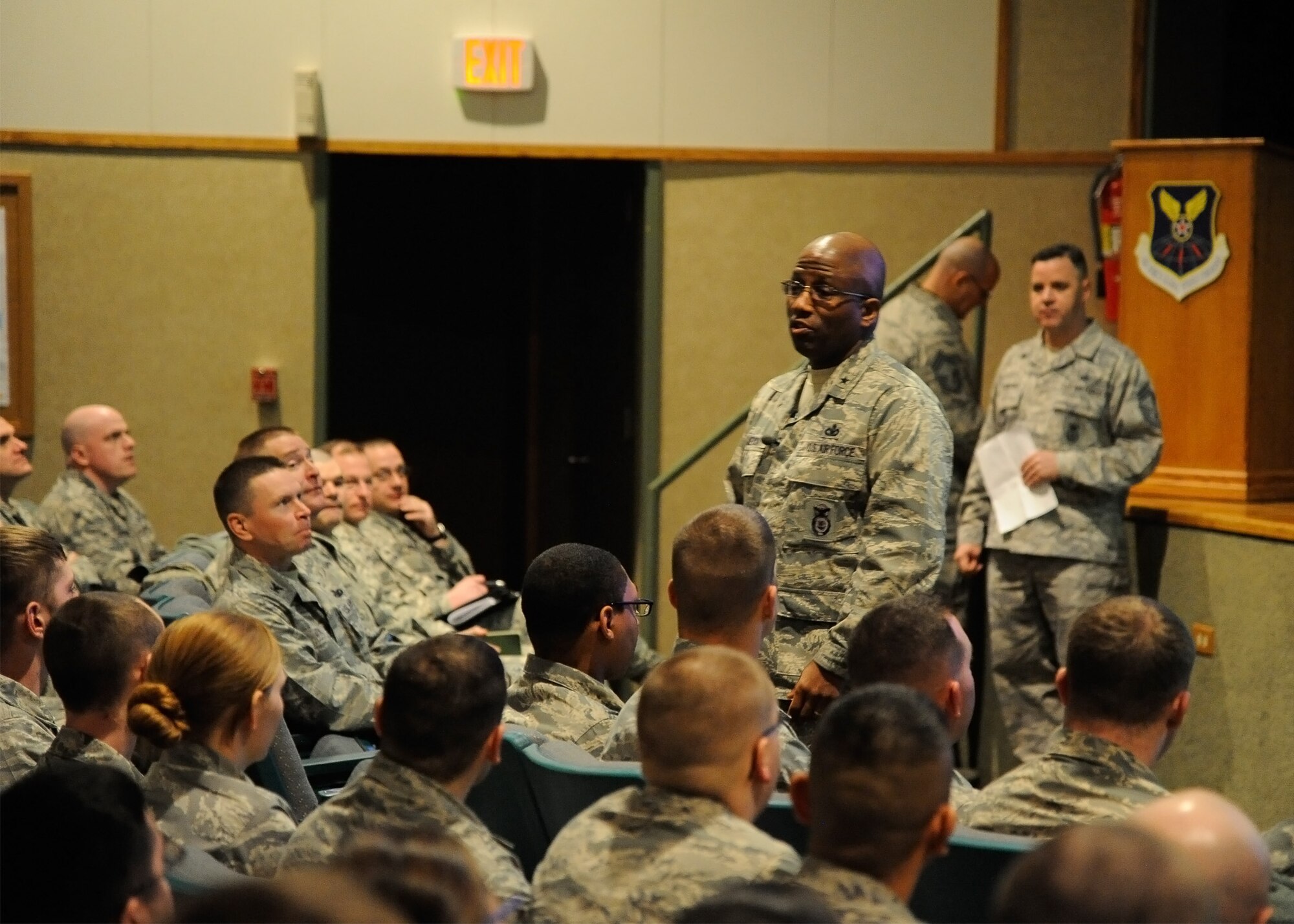 Brig. Gen. Allen Jamerson, director of security forces (right center), speaks with Team Malmstrom members during an all call at the base auditorium Feb 10. During the all call, Jamerson addressed questions security forces personnel had regarding the recent changes, such as longer shifts and different manning levels, to their career field and his plans for the future of security forces. (U.S. Air Force photo/Airman 1st Class Collin Schmidt)