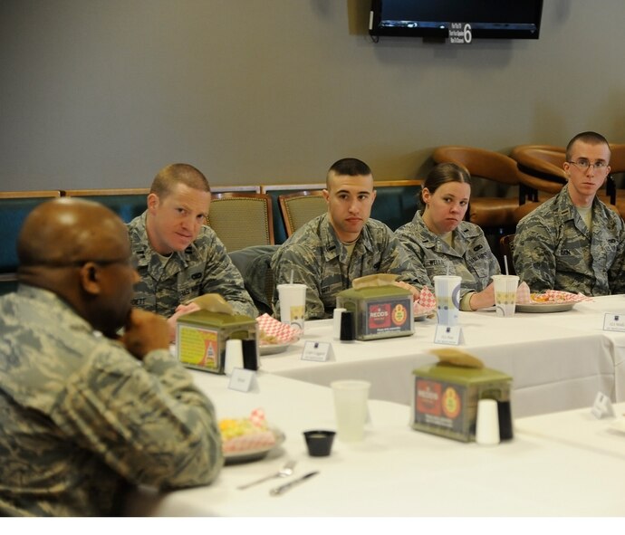 Officers listen to Brig. Gen. Allen Jamerson, director of security forces (left), share stories of his military career during a luncheon at the Aces High Bowling and Entertainment Center on Feb. 10. After listening to Jamerson’s stories, the officers shared some of their military experiences and gave opinions on what would they believed would foster a good working environment for Airmen and officers alike. (U.S. Air Force photo/Airman 1st Class Collin Schmidt)