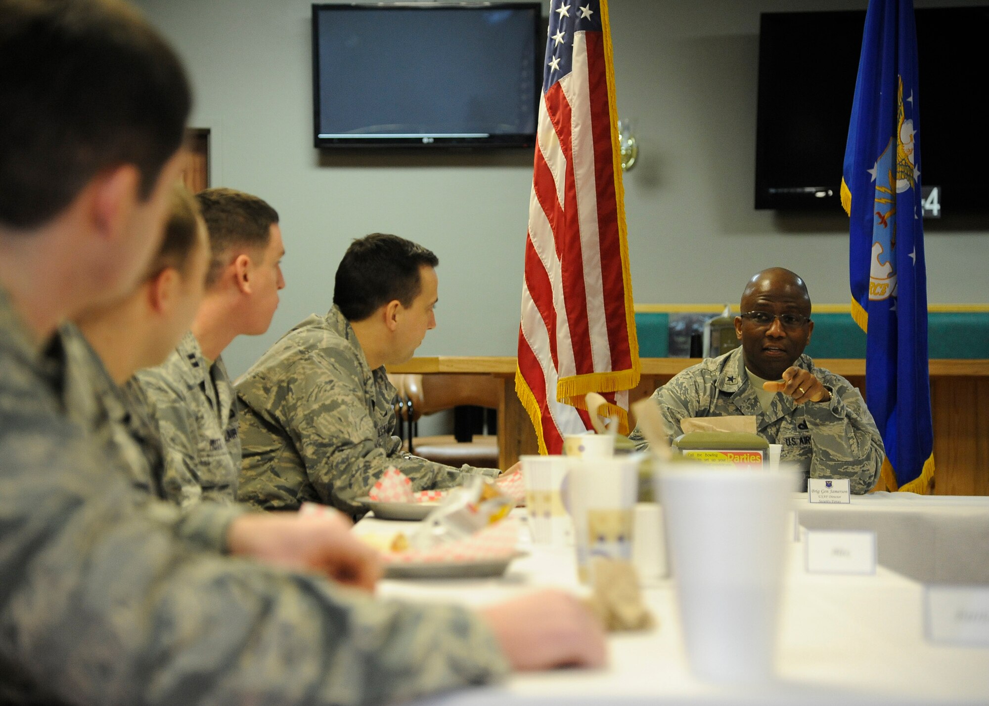 Brig. Gen. Allen Jamerson, director of security forces (right), speaks with security forces officers during a luncheon at the Aces High Bowling and Entertainment Center on Feb. 10.  During the luncheon, Jamerson answered questions regarding his plans to help military personnel on Malmstrom succeed in their mission. (U.S. Air Force photo/Airman 1st Class Collin Schmidt)