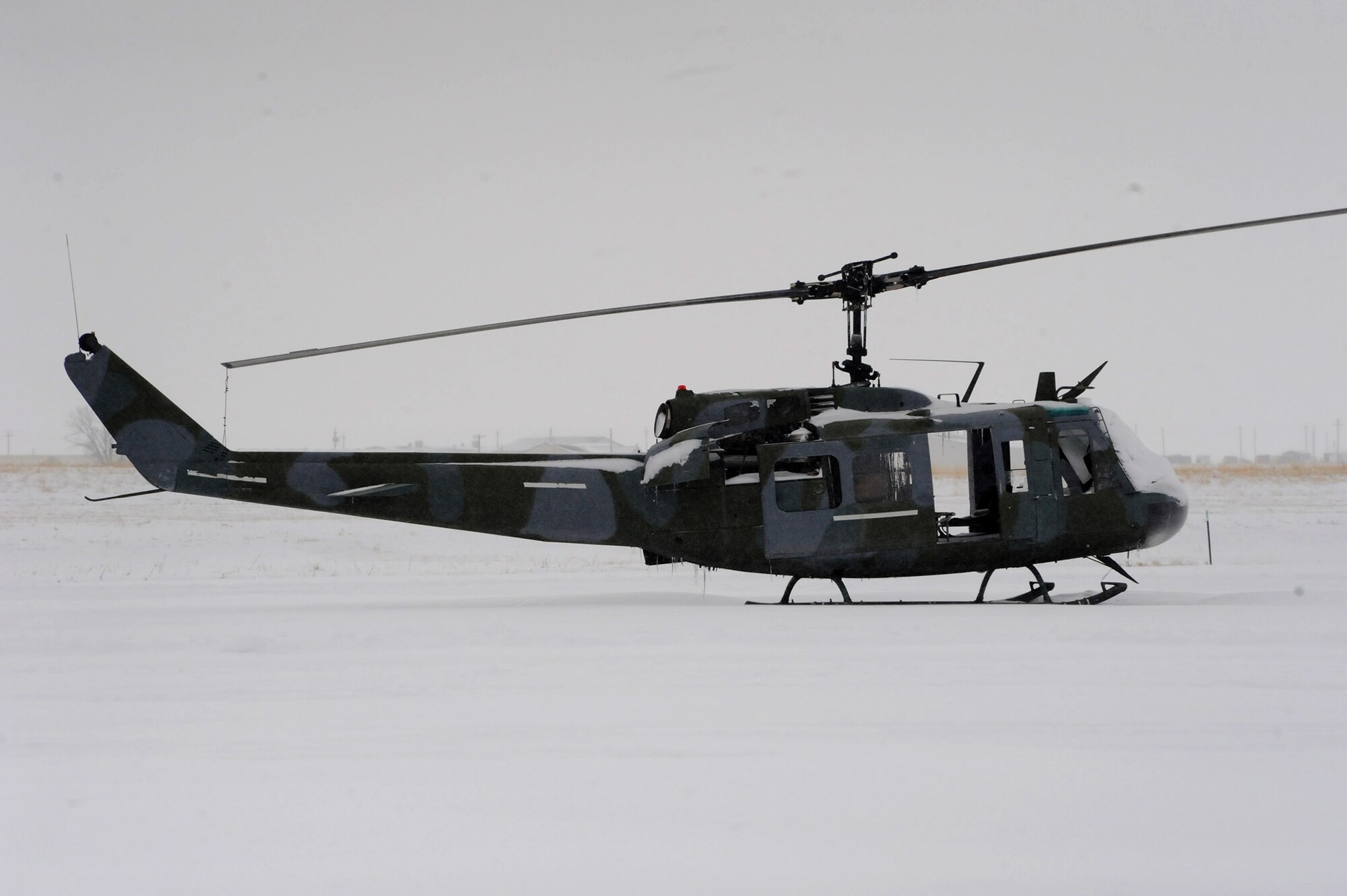 A decommissioned UH-1N Huey helicopter sits on the flight line of Malmstrom Air Force Base. Pilots and aircraft crew members must be aware of changes in weather – including the temperature and wind levels – while operating the helicopters. (U.S. Air Force photo/Senior Airman Cortney Paxton