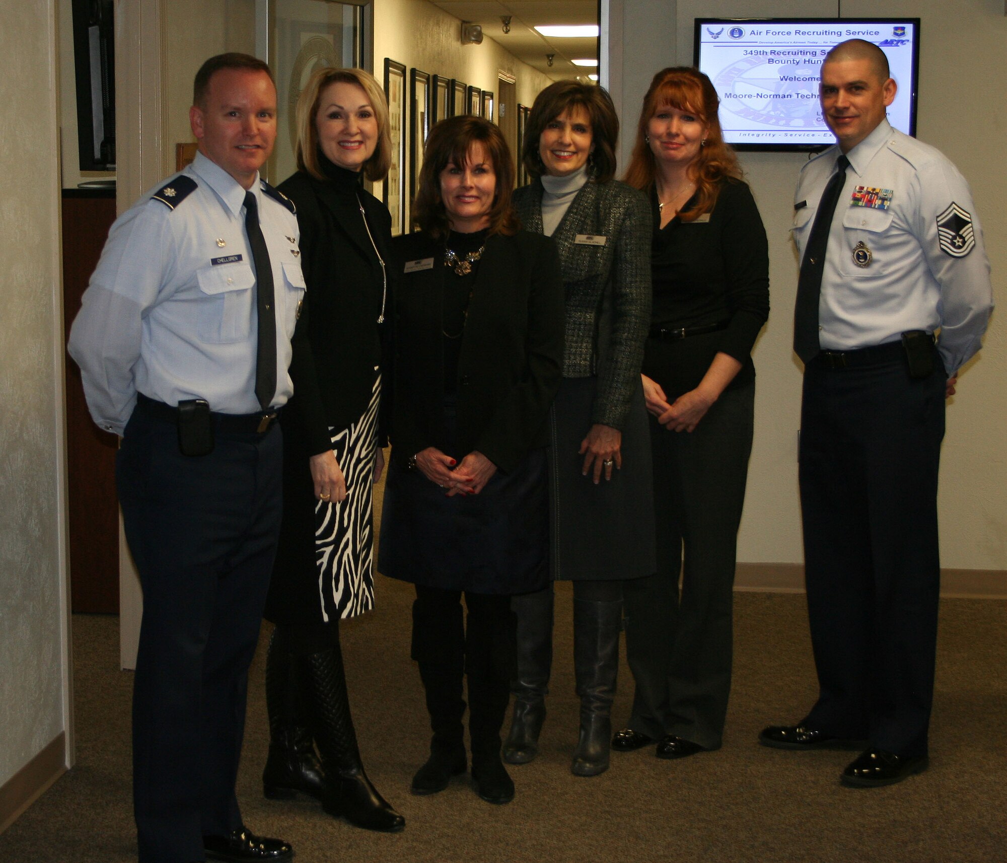 Members of the Moore-Norman Technology Center went on a “Taste of the Air Force” tour with the 349th Recruiting Squadron Jan. 17. From left are Lt. Col. Brian Chellgren, 349th RCS commander; Jane Bowen, Jeanette Capshaw, Susan Gladill and Tina Fitzgerald of the Moore-Norman Technology Center; and Senior Master Sgt. Jeffrey Morris, 349th RCS production superintendent. Fitzgerald is the employment advisor, Gladhill is the director of educational services, Bowen is the superintendent and Capshaw is the assistant superintendent. (U.S. Air Force photo)

