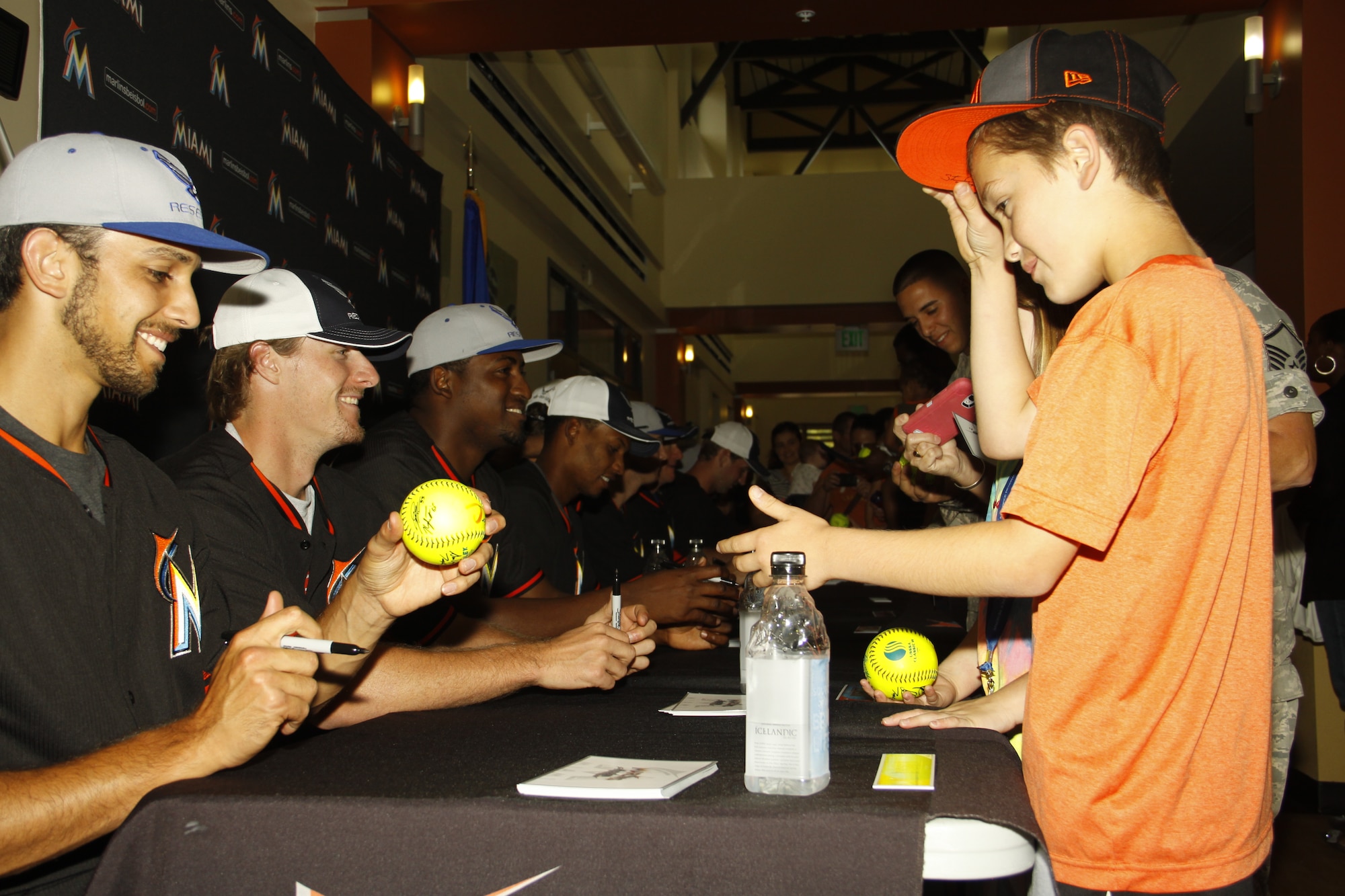The Miami Marlin’s baseball team singing autographs on anything from baseballs to T-shirts during the Team Homestead Appreciation day at Homestead Air Reserve Base, Fla., Feb. 13. (U.S. Air Force photo by/Senior Airman Jaimi L. Upthegrove)