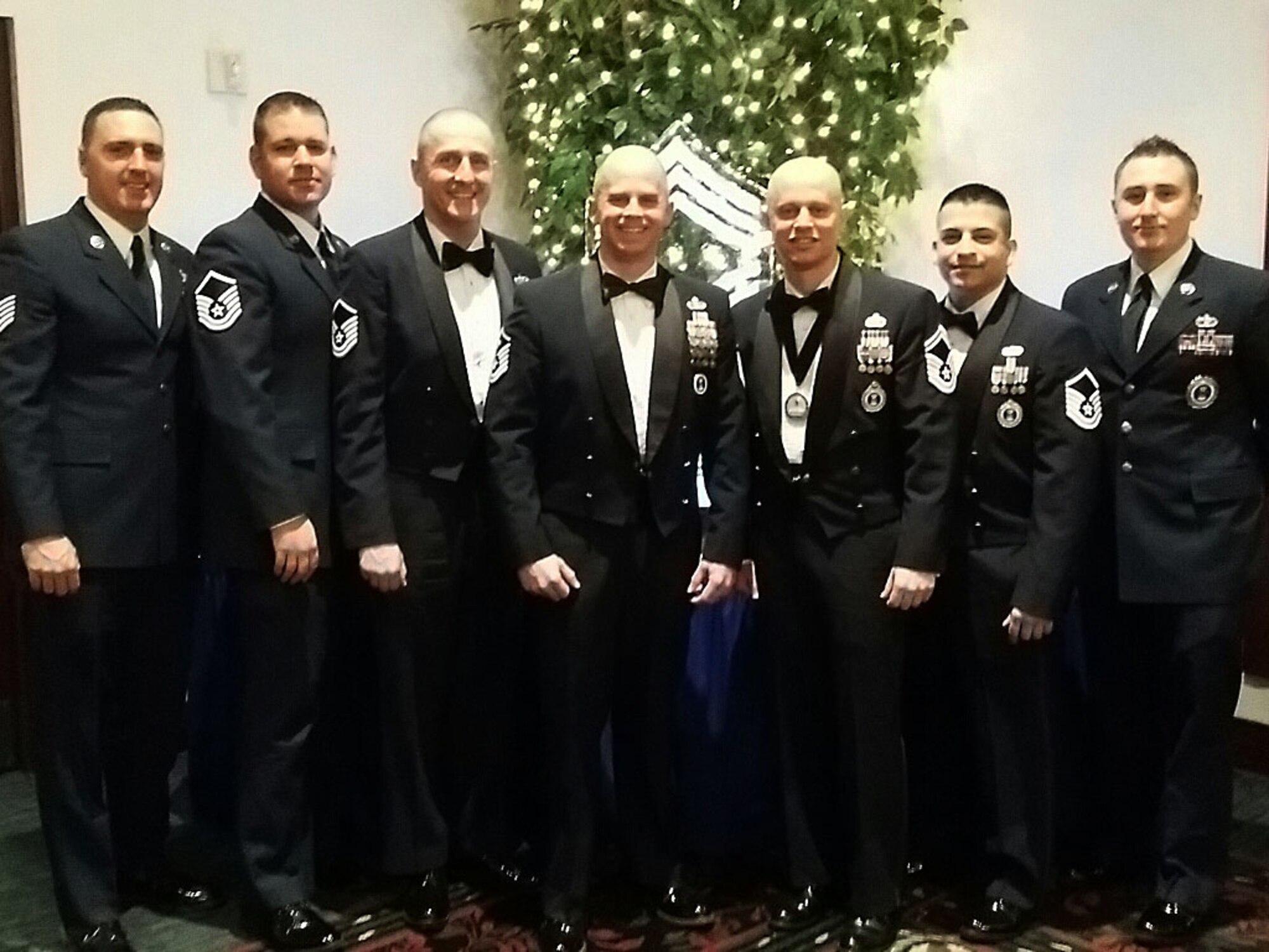Members of the 345th Recruiting Squadron gathered at Scott Air Force Base, Ill., Jan. 24 for the Chief Master Sergeant Recognition Ceremony. From left are Tech. Sgt. Daniel Hopper, marketing NCO; Master Sgt. Michael Clark, E-Flight chief; Master Sgt. Darryl Gullekson, training NCO: Master Sgt. Michael Cline, first sergeant; Senior Master Sgt.  Michael Kovach, production superintendent and one of the chief master selectees being honored; Master Sgt. Johnny Martinez, senior trainer; and Staff Sgt. Nicholas Miano, training NCO. (U.S. Air Force photo/Lt. Col. Sharon Presley) 


