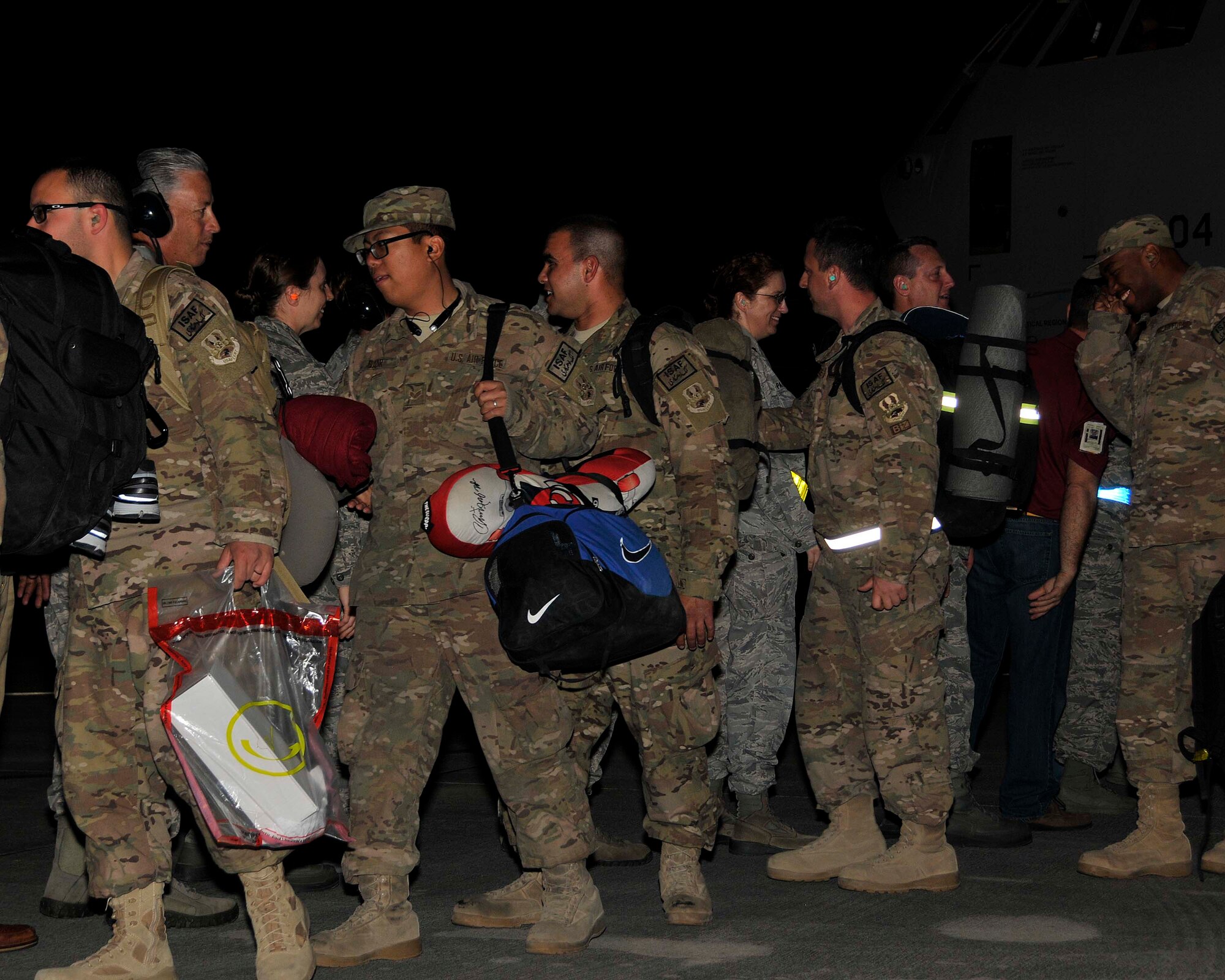 Homestead Air Reserve Base leadership and coworkers of the deployed service members lined up to greet them as they went from the plane that brought them back, to the bus that would take them to their loved ones at Homestead ARB, Fla., Feb. 10. (U.S. Air Force photo by/Senior Airman Jaimi L. Upthegrove)