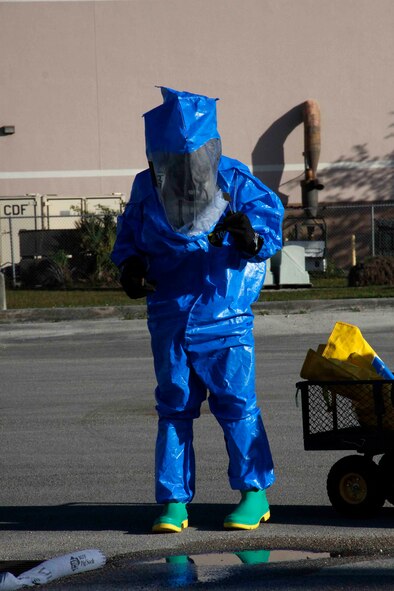 A member of the 482nd Civil Engineering Squadron Emergency Management flight, at Homestead Air Reserve Base, Fla., tests the ph-balance of runoff from a spill after protecting the waterway with a pig sock during their annual hazardous material exercise at Homestead ARB, Feb. 8. (U.S. Air Force photo by/Senior Airman Jaimi L. Upthegrove)