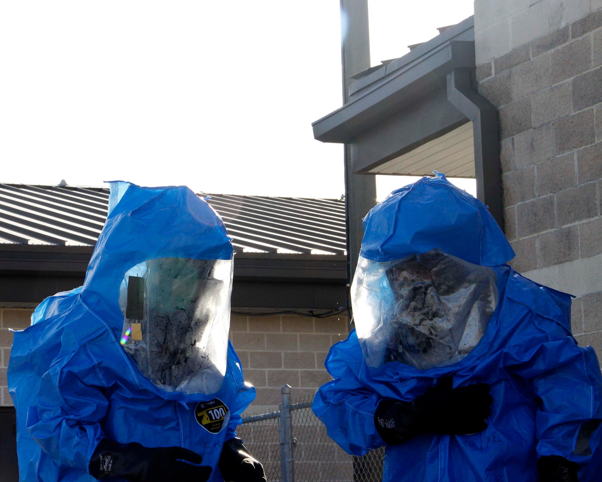 Senior Airman Juan Rodriguez and Senior Airman Anthony Ramirez, emergency management technicians with the 482nd Civil Engineering Squadron Emergency Management flight at Homestead Air Reserve Base, Fla., asses the scene during their annual hazardous material exercise at Homestead ARB, Feb. 8. (U.S. Air Force photo by/Senior Airman Jaimi L. Upthegrove)