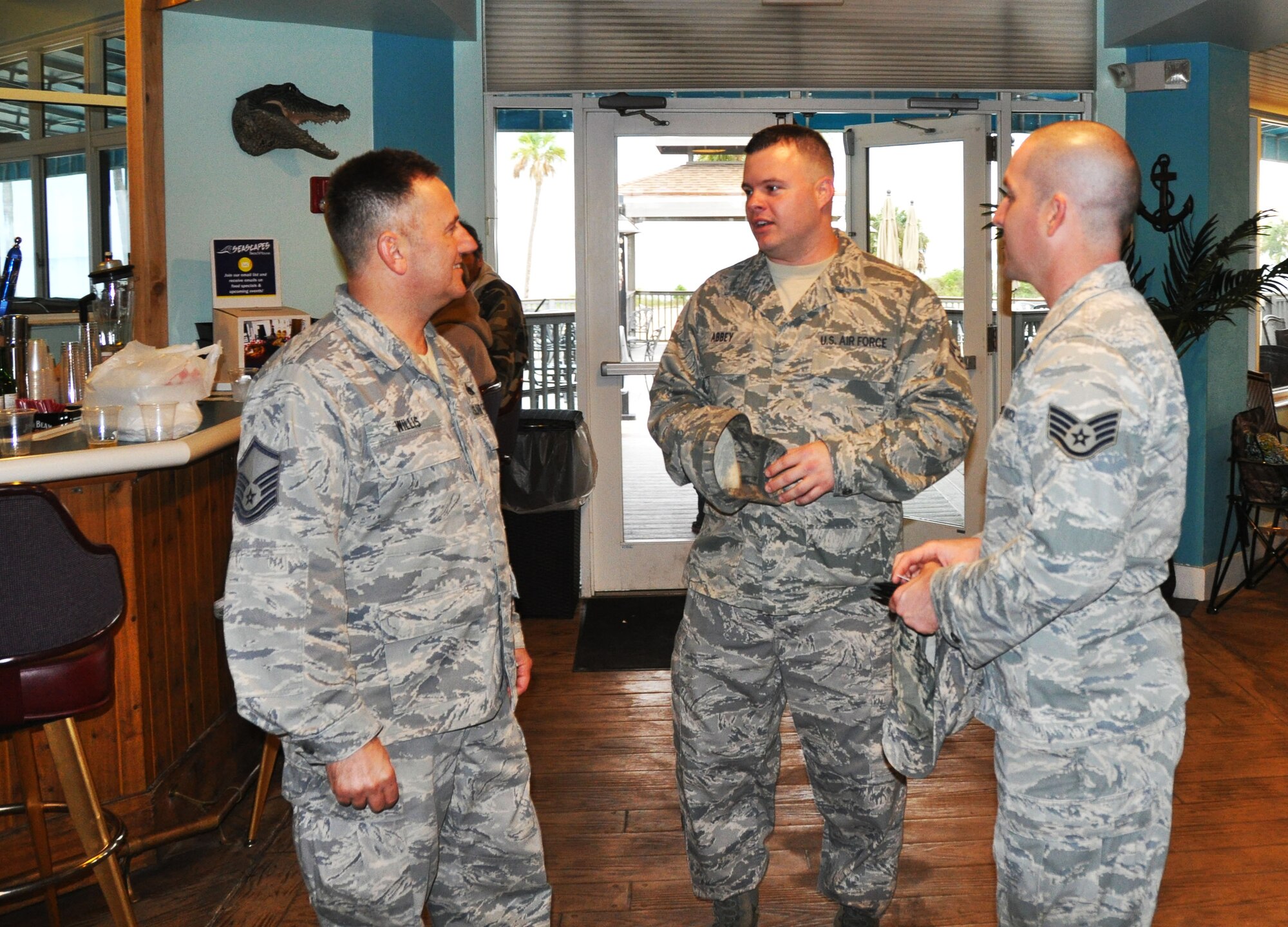 Master Sgt. Terry Willis, 927th Maintenance Group acting First Sergeant,
Staff Sgt Christopher Ellis, diagnostic imaging technician and Senior Airman
Jason Abbey, a biomedic equipment journeyman catch up on work, life outside
of work and being a traditional reservist as they wait for the rest of the
group. (U.S. Air Force photo by Staff Sgt. Nicholas Collins) 
