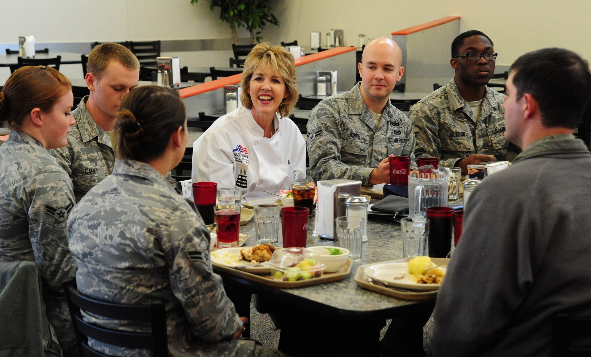 Jara Allen, Hennessy Team evaluator, speaks to a group of dorm residents at the Ozark Inn dining facility at Whiteman Air Force Base, Mo., Feb. 6, 2013. Customer satisfaction with food items at the dining facility is one of 47 other grading criteria that was inspected by evaluators during the Hennessey Team’s two-day visit. (U.S. Air Force photo by Staff Sgt. Nick Wilson/Released)
