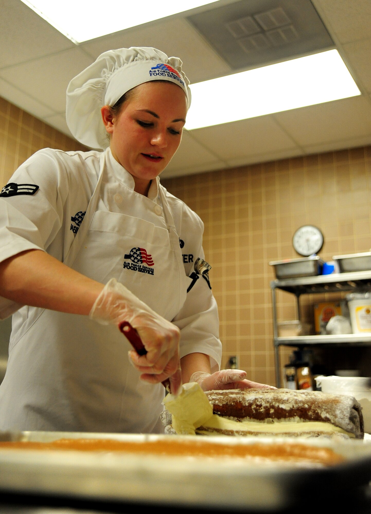 Airman 1st Class Amy Klaviter, 509th Force Support Squadron food service specialist, prepares pumpkin cheesecake rolls during a Hennessy Team inspection at the Ozark Inn dining facility at Whiteman Air Force Base, Mo., Feb. 6, 2014. Klaviter was also the recipient of the Hennessy Traveler’s Association Award of Excellence. Each year the Hennessy Team chooses one enlisted member from dining facility they visit to participate in a class at the Culinary Arts Institute of America in Greystone, Calif. (U.S. Air Force photo by Staff Sgt. Nick Wilson/Released)