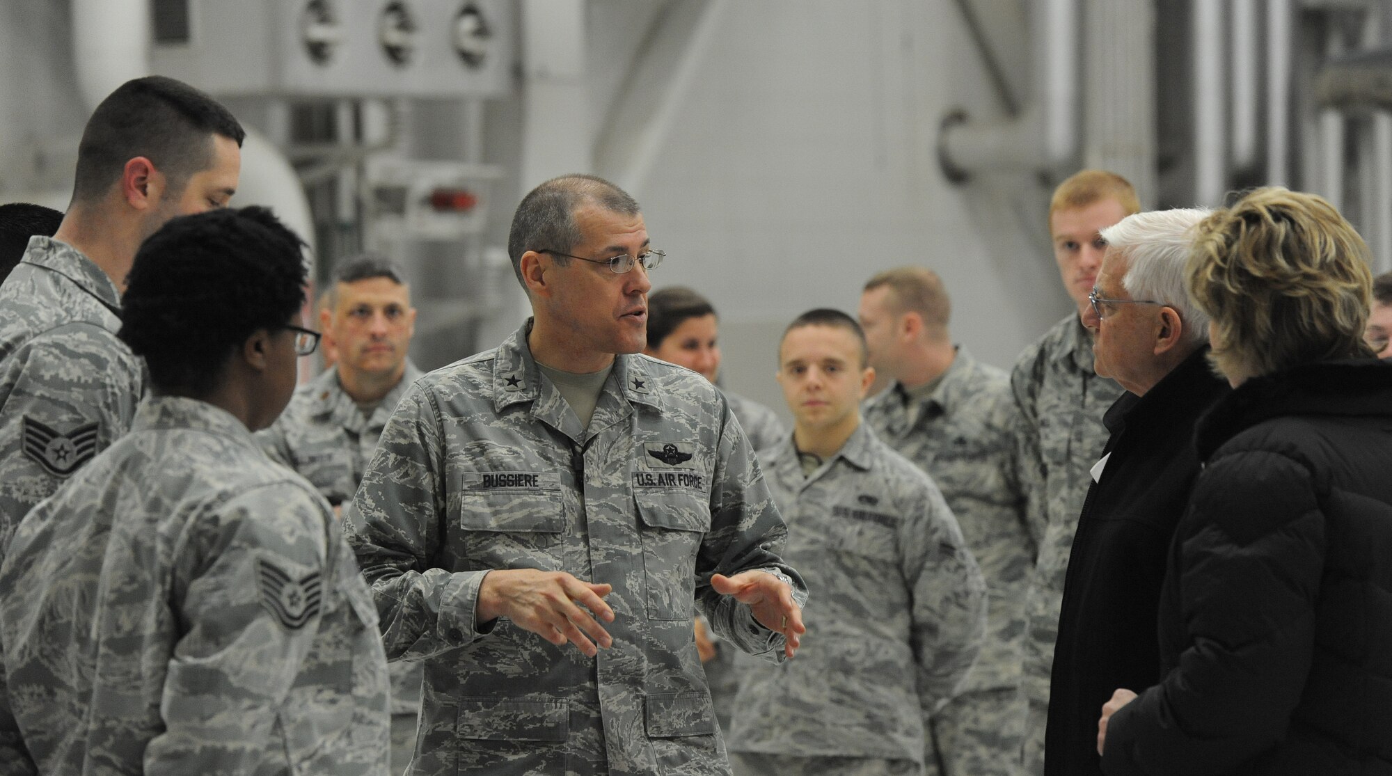 Brig. Gen. Thomas Bussiere, 509th Bomb Wing commander, briefs Hennessy Team evaluators on the inflight meal experience during their visit to Whiteman Air Force Base, Mo. Feb. 5, 2014. After the brief, Bussiere gave evaluators a tour of a B-2 Spirit.. (U.S. Air Force photo by Staff Sgt. Nick Wilson/Released)