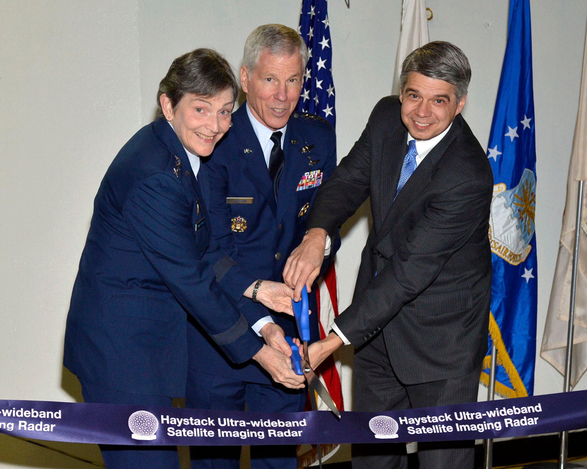 WESTFORD, Mass. -- Lt. Gen. Ellen M. Pawlikowski, Space and Missile Systems Center commander, Gen. William L. Shelton, Air Force Space Commander commander and Dr. Eric D. Evans, MIT Lincoln Laboratory director, cut the ribbon commemorating a significant upgrade to the Haystack Ultra-wideband Satellite Imaging Radar, or HUSIR, system Feb. 11. The upgrade adds W-band capabilities to the existing X-band capabilities, allowing for enhanced identification of objects in space. (Photo courtesy of MIT Lincoln Laboratory/Jon Barron)
