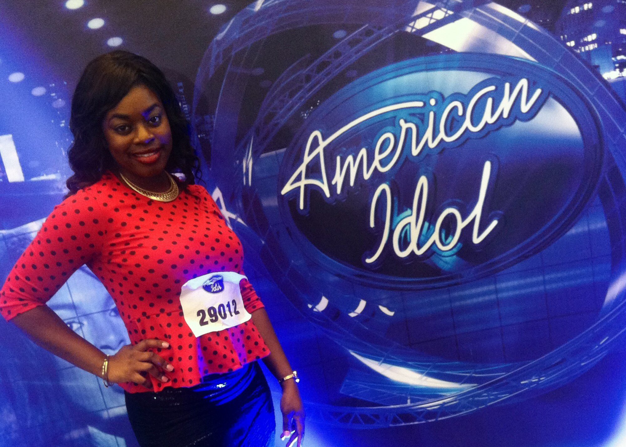U.S. Air Force Senior Airman Paula Hunt, a vocalist with the U.S. Air Force Heartland of America Band at Offutt Air Force Base, Neb. poses next to the American Idol sign on Oct. 14 in Omaha, Neb. after she was advanced to the final audition of American Idol’s Hollywood Week. (Courtesy Photo)