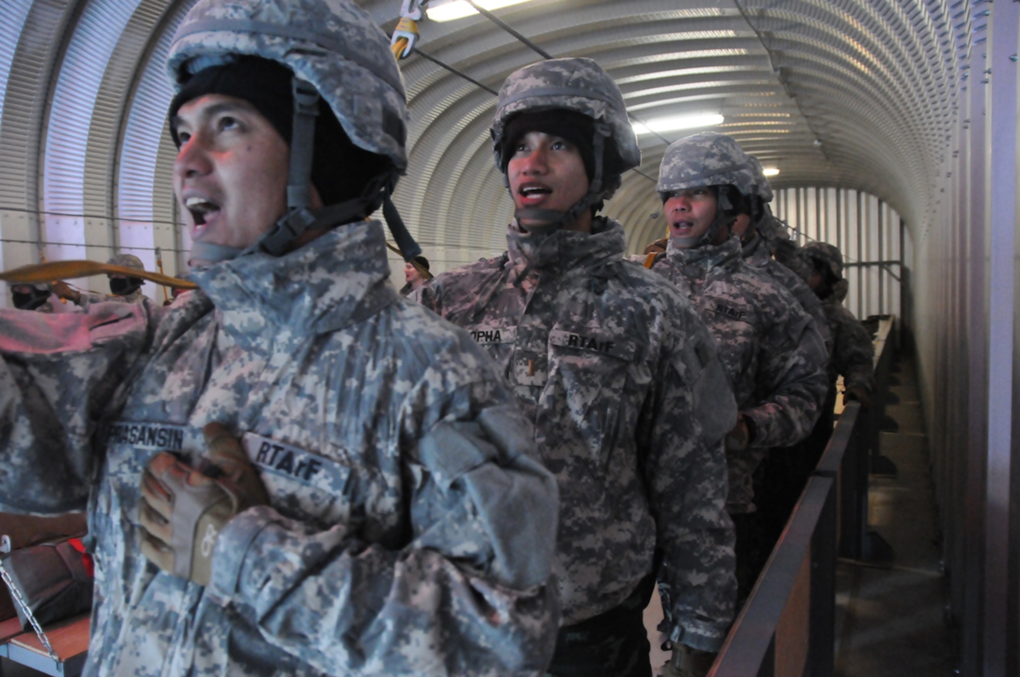 Service members with the Royal Thai Armed Forces train on proper airborne operation procedures while inside a mock aircraft Feb. 5 at the Airborne Sustainment Training Area on Joint Base Elmendorf-Richardson. Paratroopers with the 4th Infantry Brigade Combat Team (Airborne), 25th Infantry Division hosted the Kingdom of Thailand service members at JBER as they participated in the large, multinational Exercise Cobra Gold 2014. The exercise, now in its 33rd iteration, demonstrates the commitment of the U.S. and the Kingdom of Thailand to their long-standing alliance, regional partnership, and prosperity and security in the Asia-Pacific Region. (U.S. Army photos/Staff Sgt. Jeffrey Smith)