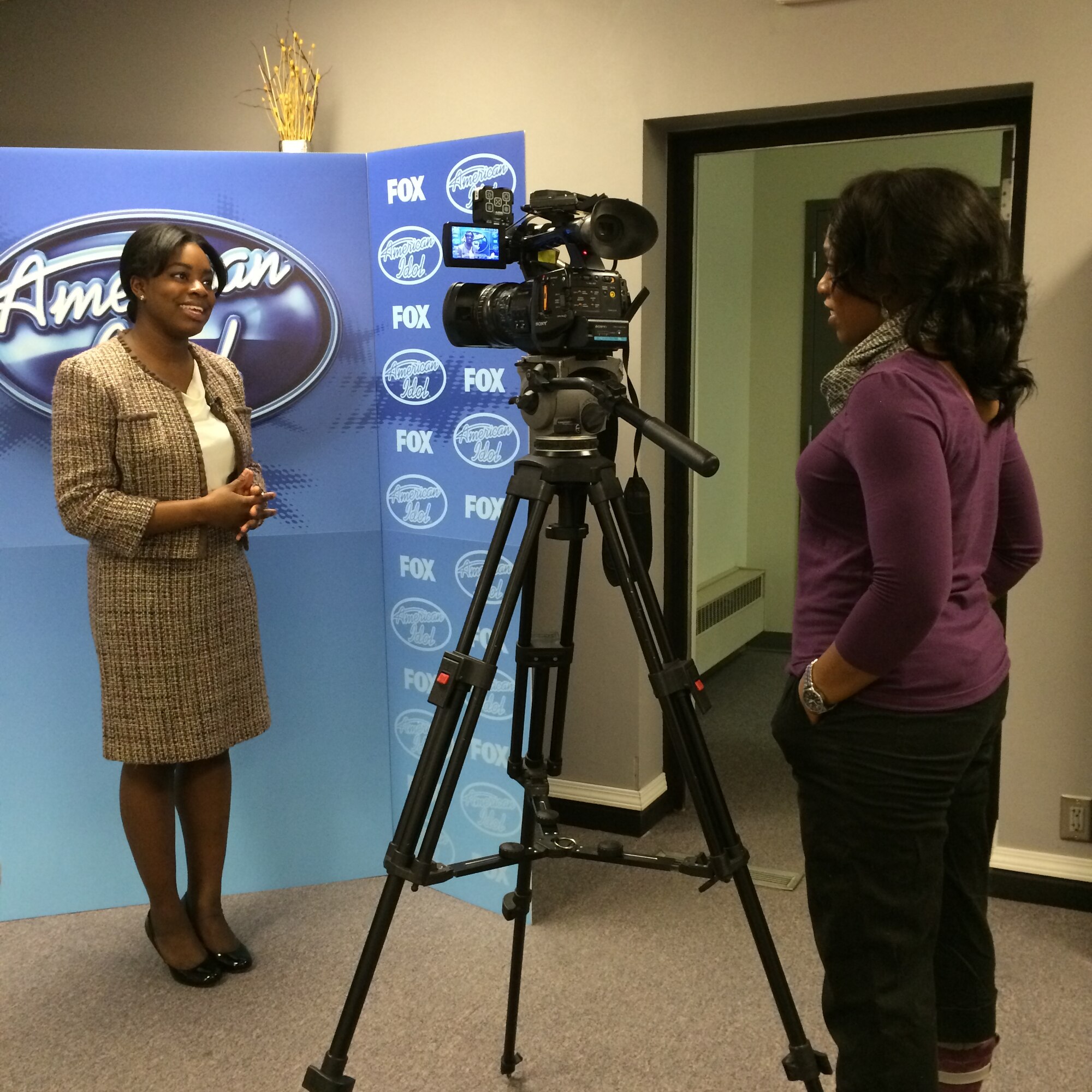U.S. Air Force Senior Airman Paula Hunt, a vocalist with the U.S. Air Force Heartland of America Band at Offutt Air Force Base, Neb., gets interviewed by a local TV station regarding her American Idol experience on Feb. 3. Hunt tried out for American Idol during the Omaha auditions, which aired Jan. 30, sending her to Hollywood Week. (U.S. Air Force photo by 2nd Lt. Carly Costello)